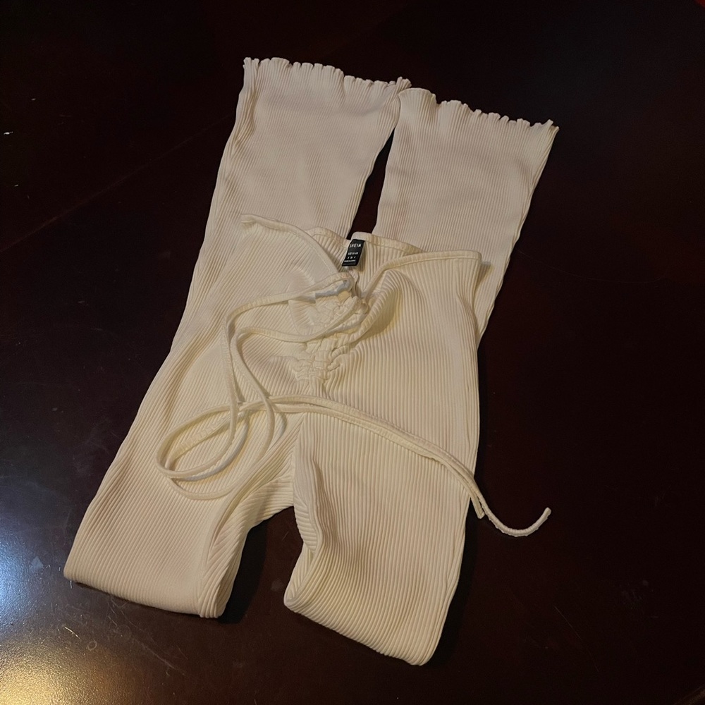 White flare pants